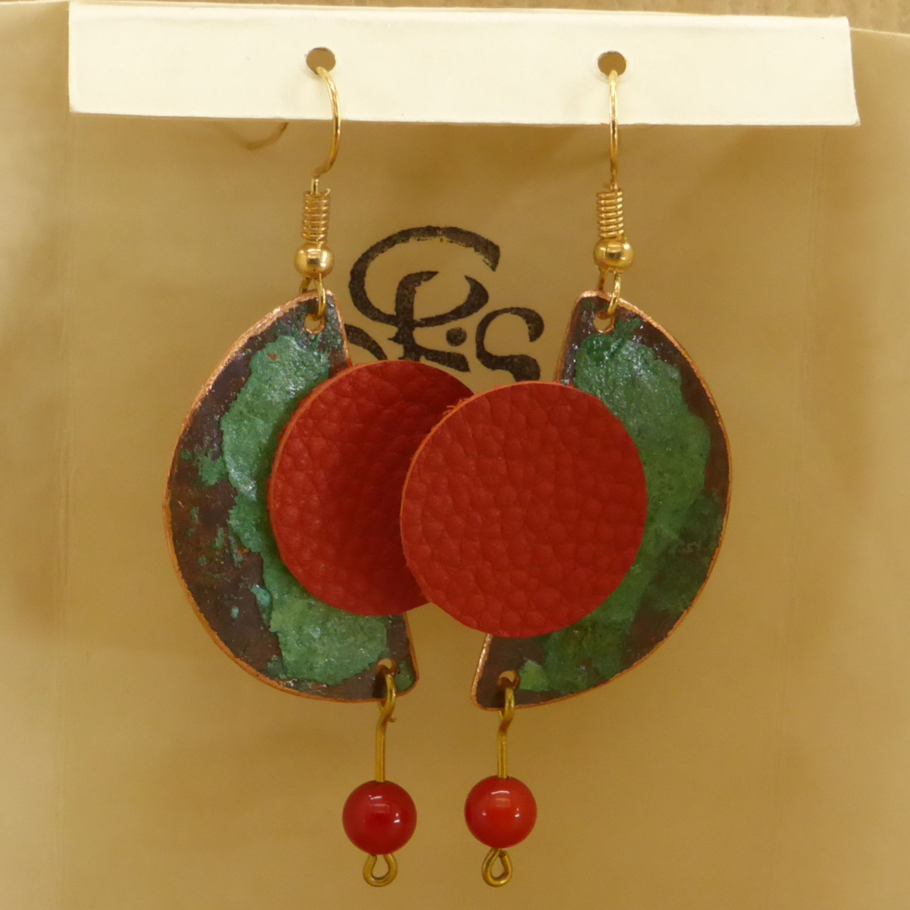 Half moon patinated copper and round red leather earrings