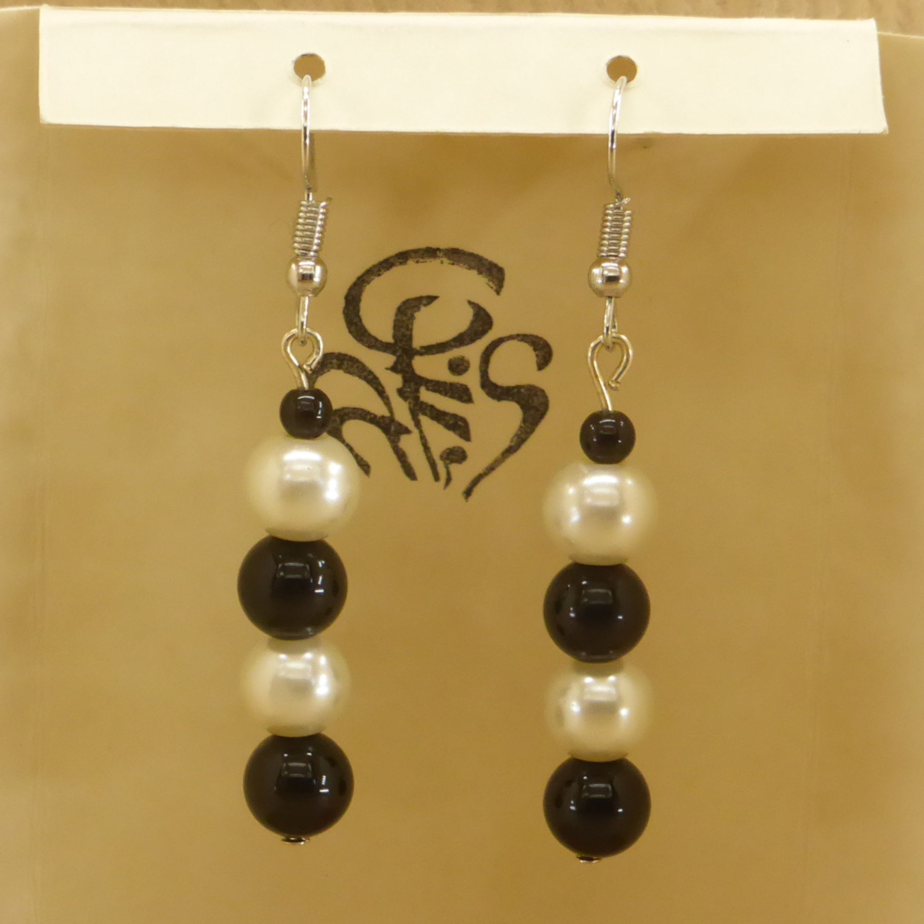 Stacked black glass and imitation mother-of-pearl pearl earrings